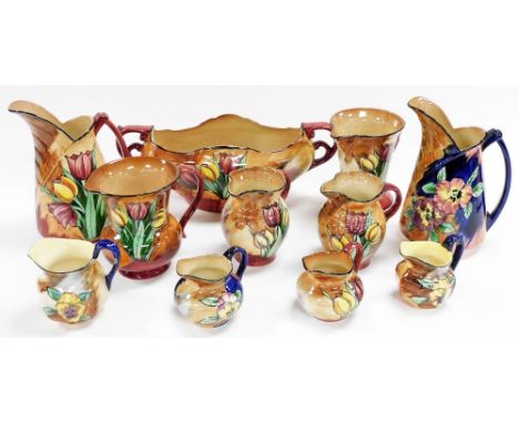 A group of H&amp;K Tunstall Viola pattern pottery, to include jugs of varying sizes, and a two handled vase, 36cm wide.