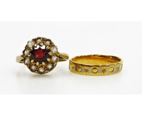 A garnet ring, in a surround of white sapphires, in a yellow metal shank, size J½, 3.1g, together with an 18ct gold wedding b