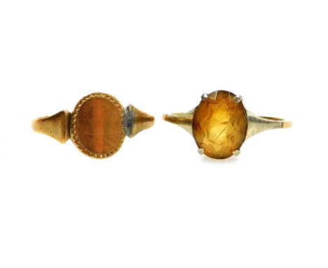 Two dress rings, comprising a signet ring, with part solder repair, stamped 9ct, and a citrine Art Deco style dress ring, wit