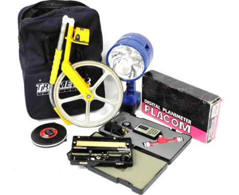 A Trumeter measuring wheel, an Allbrit Polar Planimeter, Playcom digital Planimeter, and a Draper RHL185 portable halogen lam