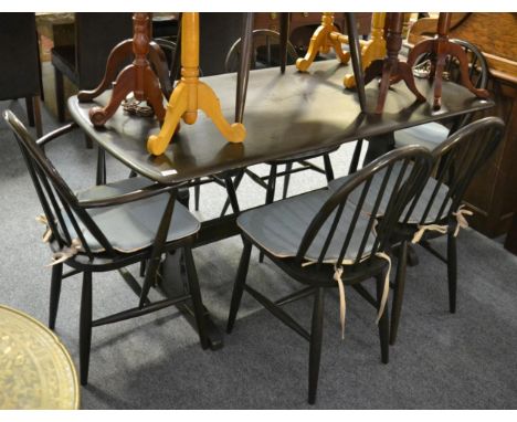 An Ercol elm refectory table, six chairs and a coffee table (8)