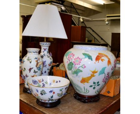 A Franklin Mint fish bowl jardiniere on hardwood stand in the Oriental taste, together with a Franklin Mint butterfly applied