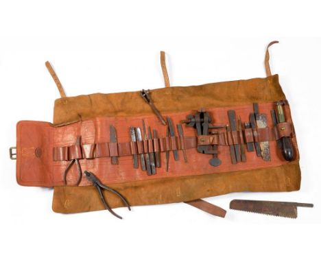 A HOLTZAPFFEL & CO LEATHER TOOL ROLL CONTAINING A COMPREHENSIVE VIRTUALLY FULL SET OF THE ORIGINAL TOOLS INCLUDING THE ROSEWO