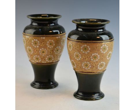 Pair of Royal Doulton Slaters Patent baluster shaped vases typically decorated with stylised foliage on a textured light brow