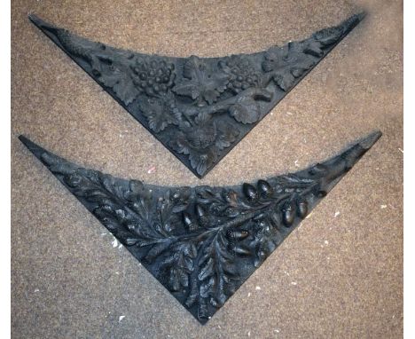 Pair of carved ebonised spandrels depicting vine and acorn decoration respectively, together with three carved wooden archite