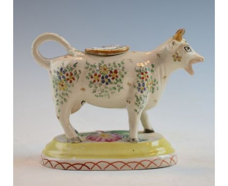Four creamware plates, 19th Century pottery cow creamer and two 19th Century cups and saucers with pink transfer printed deco