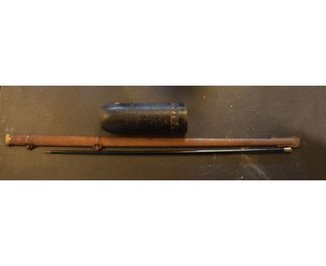 Cast metal shell case, a scabbard and a swagger stick   Condition: 