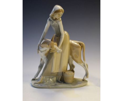Large Lladro figure of a milkmaid and calf   Condition: 