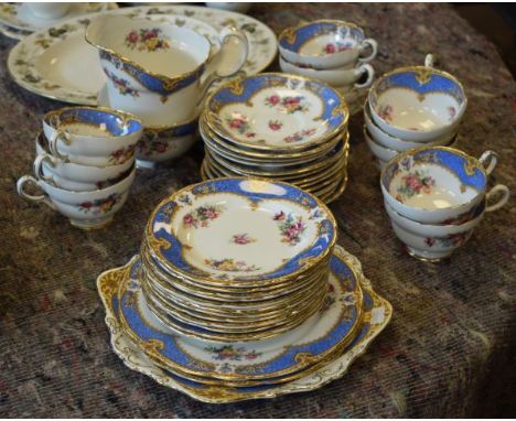 Paragon tea service having transfer printed decoration of flowers against a blue ground with gilt highlights   Condition: 