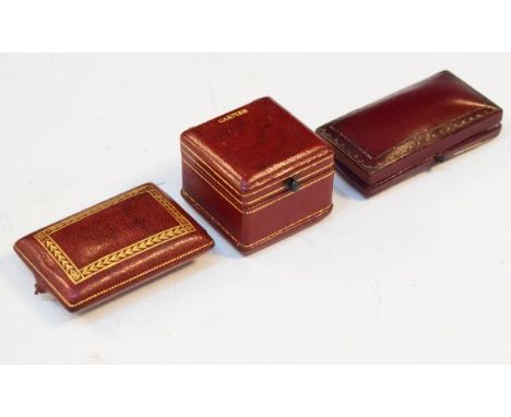 Vintage Cartier red Morocco ring box, a similar red Morocco jewellery case stamped La Cloche Freres and one other   Condition