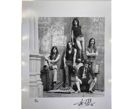 AC/DC SIGNED LIMITED EDITION PHOTO PRINT. An archival silver gelatine photo print of an image by Martyn Goddard depicting AC/