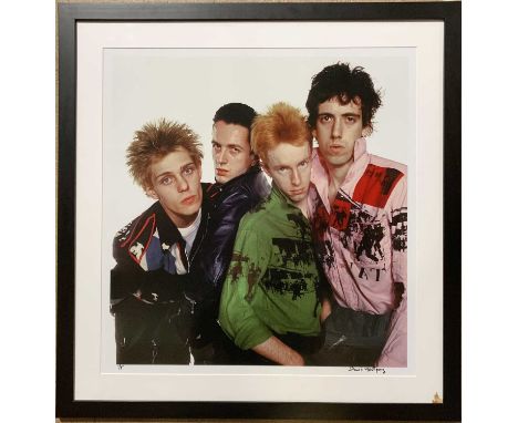 THE CLASH - DAVID MONTGOMERY SIGNED PHOTOGRAPH. A mounted and framed print of a photograph by David Montgomery depicting the 