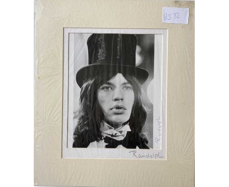 MICHAEL RANDOLPH / MICK JAGGER SIGNED PHOTO. A mounted, original photo print of an image taken by Michael Randolph. This exam