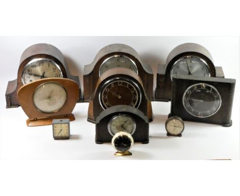 A collection of mid 20th century and later manual wind mantle clocks, to include Swiza alarm clocks, Bakelite cased examples,