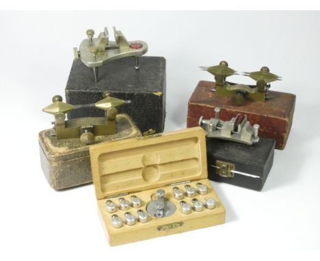 two watchmakers depthing tools, brass, cased, together with two watchmakers poising tools, one by Favourite, together with a 