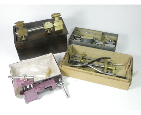 Watchmakers tools and accessories, to include two small lorch lathes, a clock main spring winder and a small bench vice.