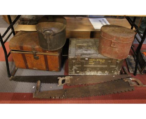 A metal military ammunition container, together with a travelling trunk and other metal storage containers and three lumberja