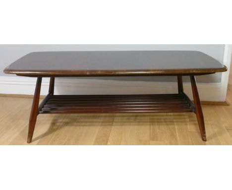 A mid 20th century Ercol occasional table, with slated under shelf on spayed legs. 105 x 37 x 46cm