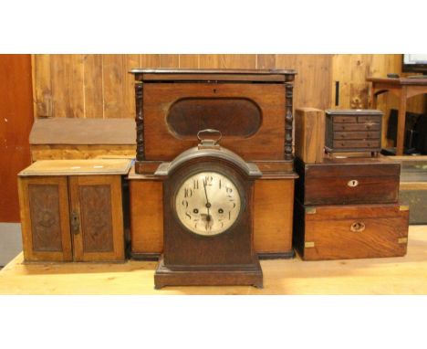 An early 20th Century oak smokers cabinet, with hinged lid and carved panel doors to reveal fitted interior, together with mi