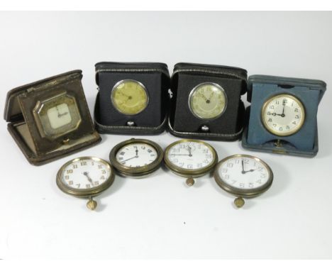 A collection of 1920s/30s eight day bedside travel clocks, together with mid Century mantle clock movements. 
