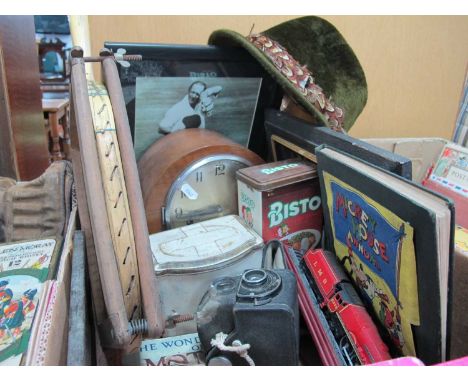 Mantle Clock, Slazenger Tennis Racket, Tins, Annuals, Leather Cap, Plaque, Boycott Signed Print, etc:- One Box