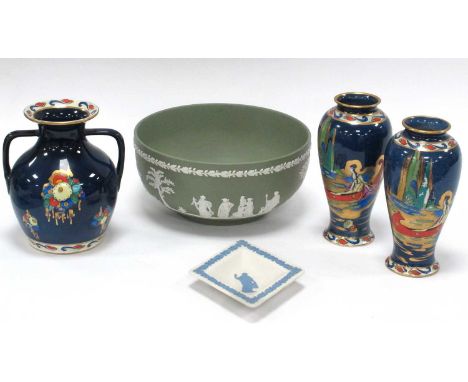 Arcadian Ware 'Blue Lagoon' Pattern pair of Spill vases and matching twin-handled vase, depicting Hiawatha in a canoe, a gree