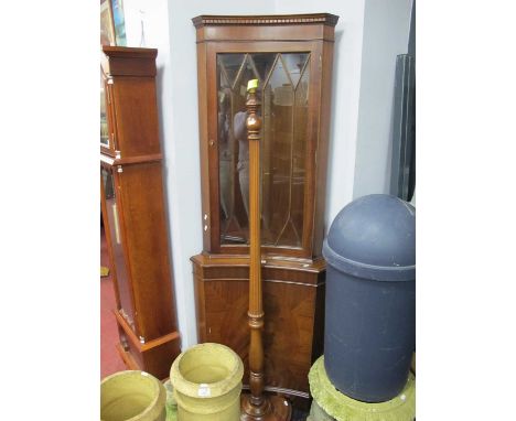 XX Century Standard Lamp, with a reeded column, on a circular base together with a mahogany corner cupboard. (2)