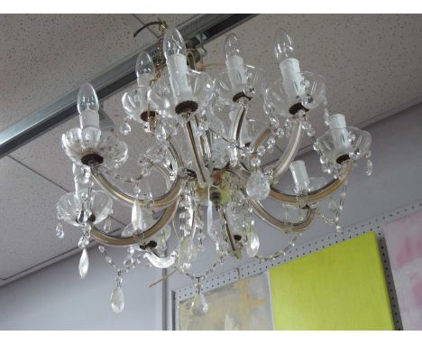 Eight Branch Chandelier, with faceted glass drops.