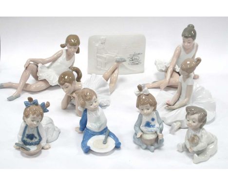 Nao ballerina figurines all seated, four babies eating and a Lladro Collectors Society plaque signed:- One Tray