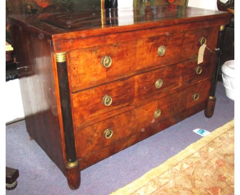 COMMODE, early 19th century North Italian Empire figured walnut, ebony and gilt metal mounted with three drawers and columns,