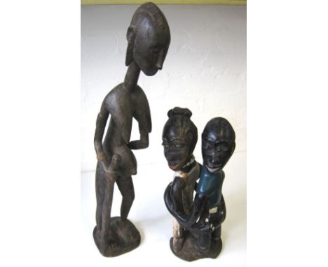 WEST AFRICAN FIGURE CARVING, study of a female with stick, 68cm H; another Bamana tribe depicting a couple getting married, 4