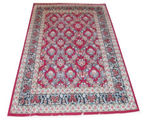 UNUSUAL TABRIZ CARPET, 280cm x 185cm, all over design of linked palmettes on a ruby field within various bands and correspond