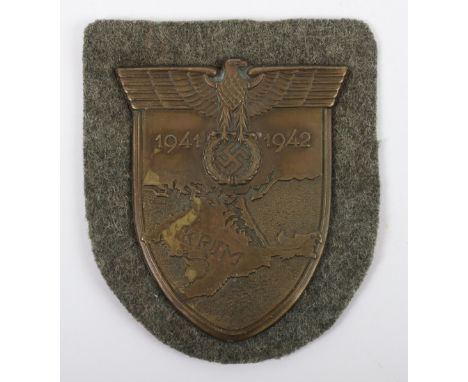 WW2 German Army / Waffen-SS Krim Campaign Shield, fine example with original green cloth backing and the paper backing to the