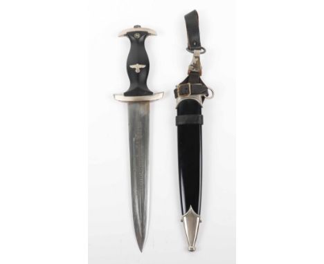 Third Reich SS Enlisted Mans Dress Dagger, with black grip having enamel SS runes emblem and eagle inserted. Housed in scabba