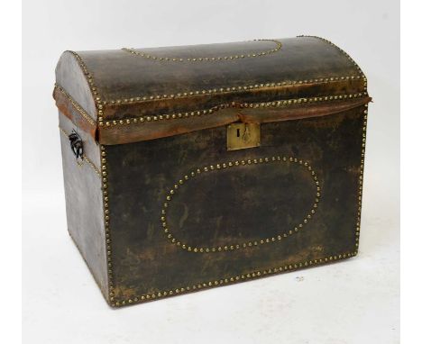 A late 19th/early 20th century dome top steamer trunk, with green leather covering, studded border and oval, and striped inte