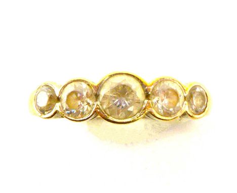 A 9ct gold dress ring with five graduated white stones, size N, approx. 2.6g.Condition Report: - The white stones are not dia