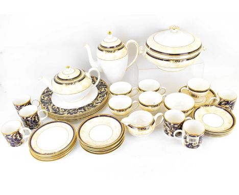 WEDGWOOD; a forty-piece 'Cornucopia' pattern tea and coffee set, comprising teapot, height 14cm, coffee pot, height 26cm, mil