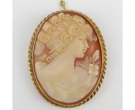 A vintage 9ct gold cameo brooch, head and shoulders of an elegant lady, hallmarked, with safety chain, 5 x 4cm, approx. 13.3g