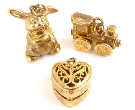 Three 9ct gold charms comprising rabbit, steam train, heart-shaped trinket box which opens to reveal a ring, combined approx.