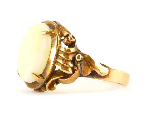 A 14ct (585) rose gold with oval claw set opal, white with flashes of red and green, in a fancy head mount, size Q, approx. 4