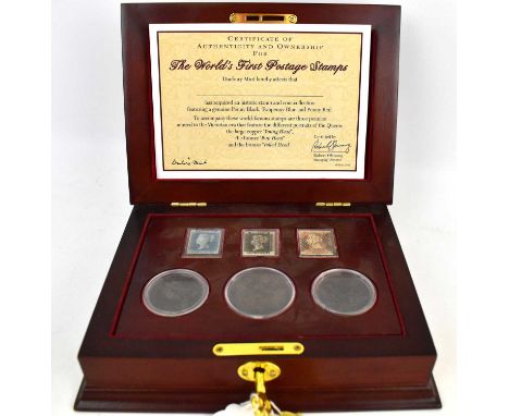 DANBURY MINT; 'The World's First Postage Stamps', featuring Penny Black, Two Penny Blue and Penny Red, accompanied by three e