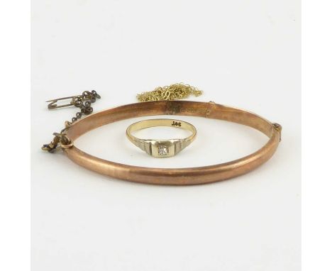 Three items of 9ct gold jewellery comprising a small Art Deco style single diamond ring, Gypsy set in a white mount, with rib
