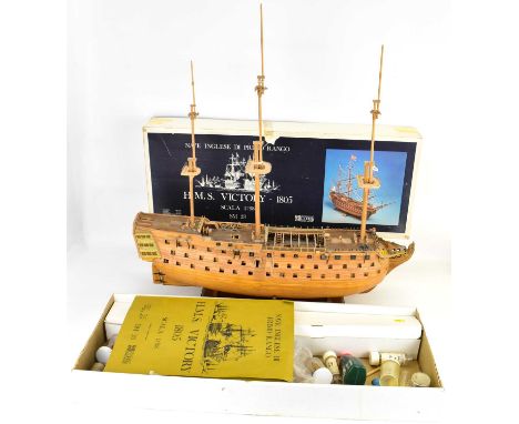 An H.M.S. Victory 1/98th scale wooden model of a galleon, part complete, with boxed remnants and plans, 74 x 70cm.Condition R