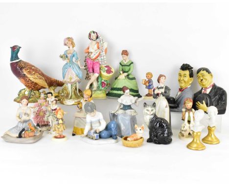 Twenty pottery, resin, antique and modern collectible figures, to include a 19th century Staffordshire musician, Laurel and H