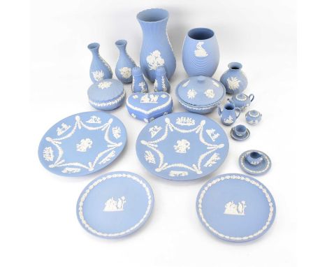 WEDGWOOD; twenty-one pieces of eggshell blue jasperware, all with applied Classical-style decoration, to include vases, heigh