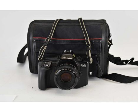 CANON; an EOS 650 camera, lens and bag.
