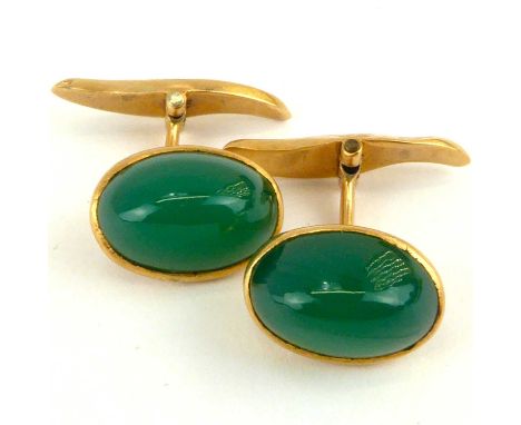 A pair of 9ct gold cufflinks set with green jade-coloured cabochons, combined approx. 4.9g.
