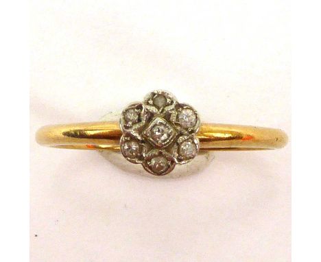 An 18ct gold ring with small diamond floral cluster, size P, approx. 2g.