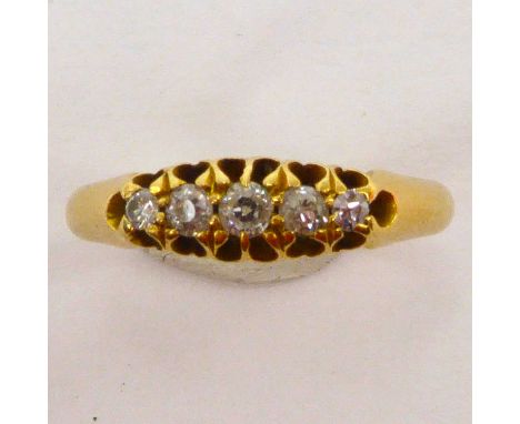 An 18ct gold ring with a row of five graduated diamonds, size L, approx. 2.2g.