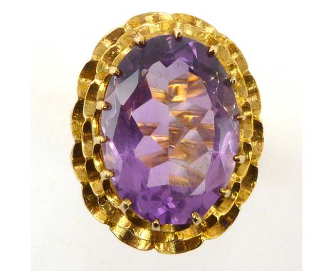 A vintage 9ct gold amethyst dress ring, the oval cut amethyst in claw set mount with open work head, size K, approx. 5.8g.